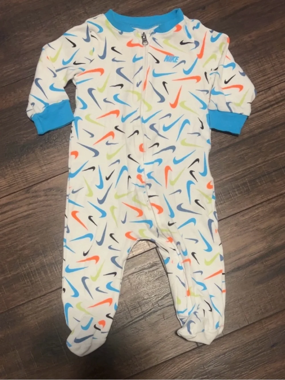 Nike White Footed One-Piece with Blue, Orange, Lime and Black Swooshes